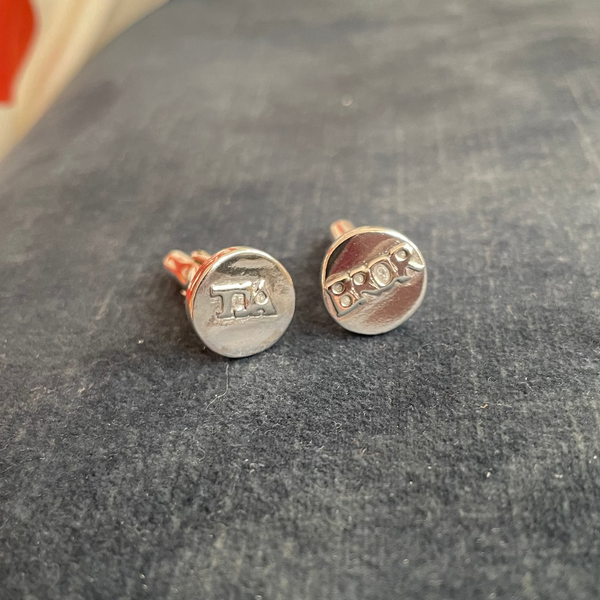 Cufflinks saying TJA and BROR